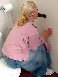 Find-Best-Tits.com presents: Blonde girl Jamie sits on the toilet and blows a black gloryhole dong